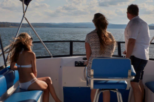 One man and two women in the captain's cabin